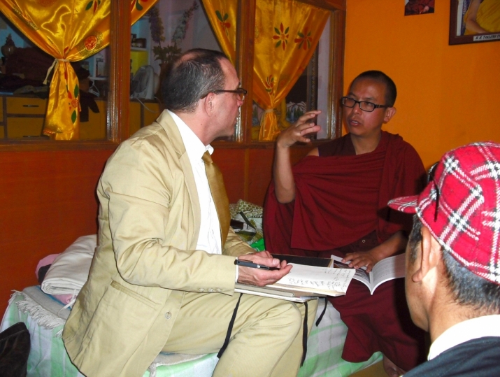 Dorje Lopon Sherab Jigmed Sangpo of Dorja Dorak Gonpa explaining the role of Cham visualization yoga to Joseph Houseal in Simla. Photo by Konchok Rinchen, from Core of Culture