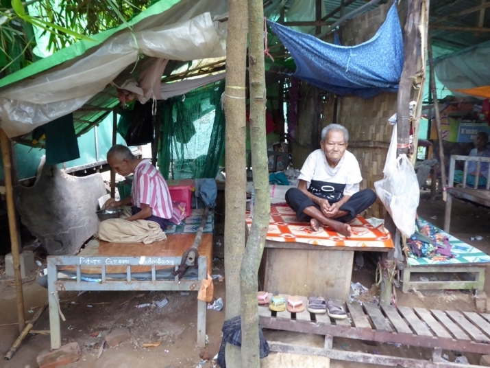 Many residents sleep under tarpaulins because of a shortage of dormitory space
