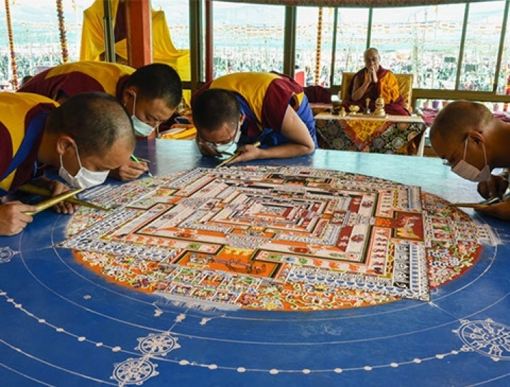 Creation of the sand mandala during the 2017 Kalachakra. From kalachakrainitiation.com
