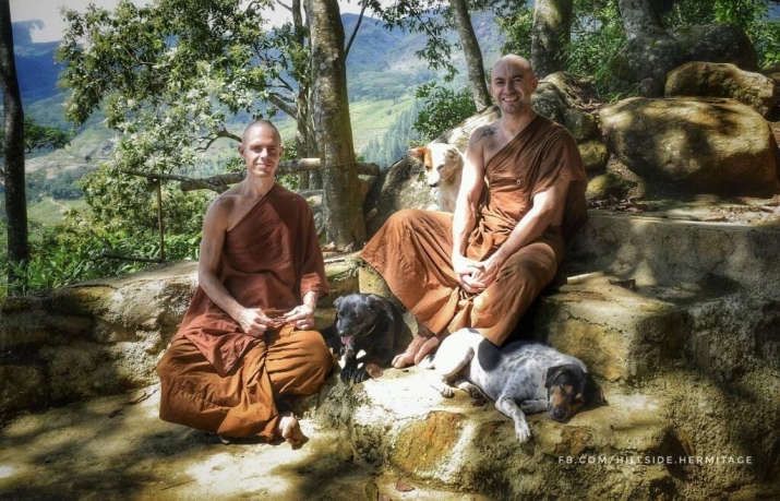 Venerable Thaniyo, left, and Ajahn Nyanamoli, right, at the hermitage with three rescued dogs. Photo by Ajahn Nyanamoli