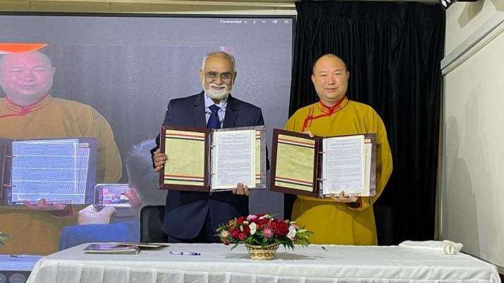 Dr. Sachchianand Joshi and Telo Tulku Rinpoche with the signed MoU. From facebook.com
