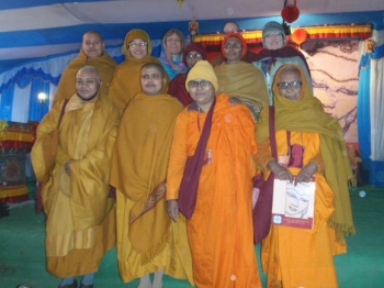 Ven. Suniti, in bright orange robes, enjoys the 13th International Sakyadhita Conference with other monastics in Vaishali, India, January 2013. From Awakening Women.