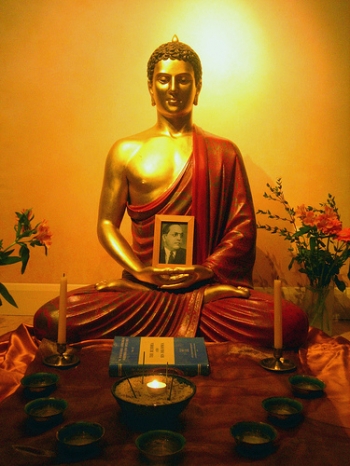 A Buddha image cradling a portrait of Dr. Ambedkar, hero and original Buddhist among Dalits. From Flickriver.com.