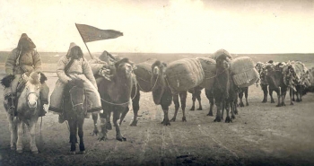 An image of an early twentieth century Oirat caravan, taken in either China or Mongolia, traveling on horseback. From commons.wikimedia.org