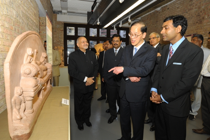 Mr. Agrawal (right) discusses a Buddhist sculpture with Tsang Tak-sing, Hong Kong's Home Affairs Secretary (centre). From the Indian Consulate in Hong Kong