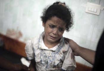 This crying girl became a symbol of the Israel-Palestine conflict after an Israeli strike at a U.N. school in Jebaliya refugee camp. From The Journal.