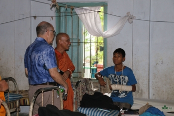 Visiting patient in mini hospital. From Jnan Nanda for Buddhistdoor International.