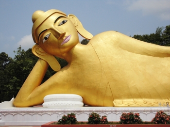 Reclining Buddha behind the restored temple