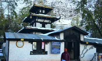 A Buddhist nun in front of the main temple of Muktinath