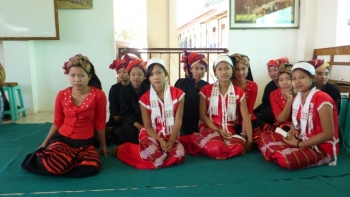 Girls at Parahita Monastery getting ready to perform a dance for rice donors