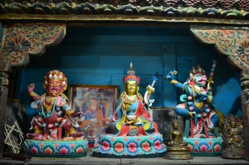 Guru Rinpoche flanked by wrathful deities