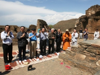 A delegation of South Korean monks offering prayers at Takht-i-Bahi. From tribune.com.pk