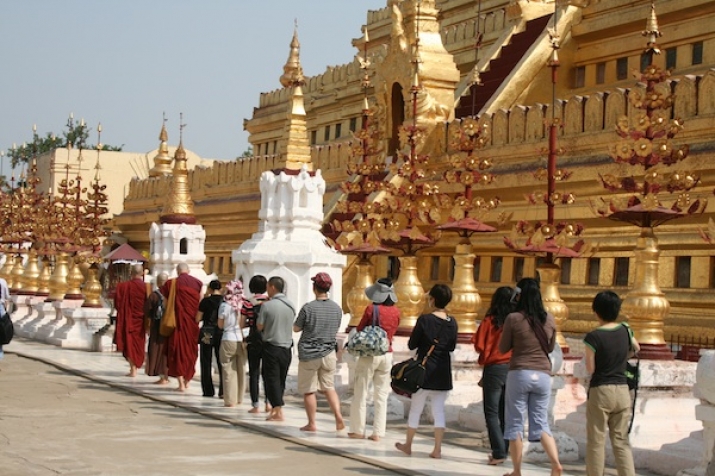 Pilgrims walking around Shwezigon Pagoda in Bagan, Myanmar