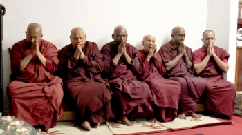 Kingsbury Temple monks in mourning on 9 August. From sriexpress.com