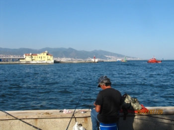 A man angling at the seaside of Izmir.
