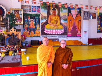 From left: Venerable Bora and Venerable Sambathsam in the main hall at Buddharangsi Temple. From Andrew. J. Williams