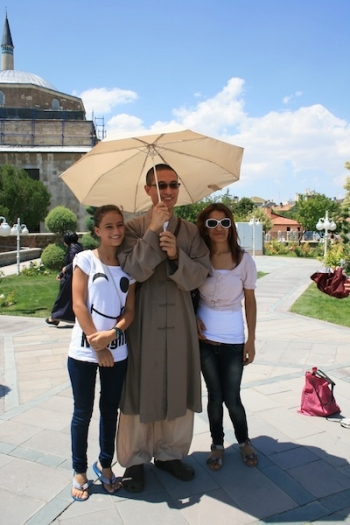 Friendly tourists asked for photos with monastic group members.