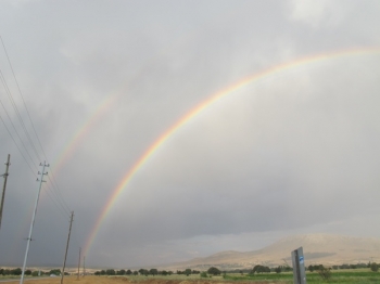 The sight of a double rainbow alludes to the possibility of religions coexisting alongside each other, benefitting all beings. One can have one's own faith while accepting others.