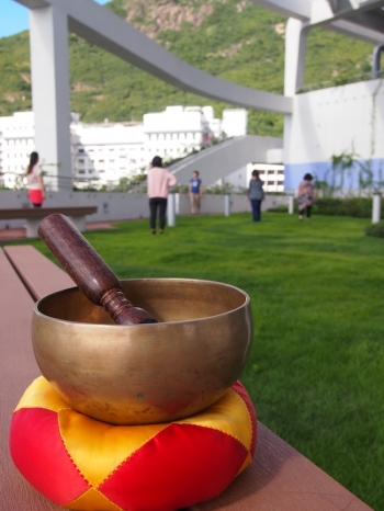 Ringing the brass bowl gently brings attention into mindful focus. photo: CBH