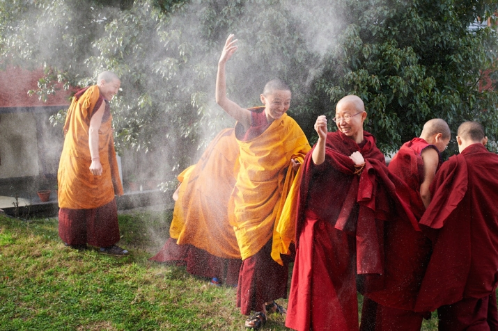 Nuns from Dolma Ling Nunnery on the third day of Losar throwing 