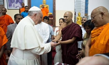 Pope Francis visiting a Buddhist temple. From The Guardian