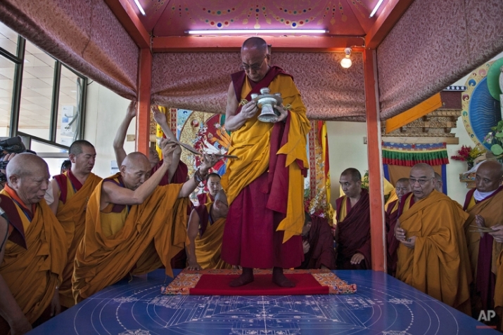 The Dalai Lama reads scriptures during preparations for a sand mandala for the 33rd Kalachakra Empowerment in Ladakh, India. From focusnews.com