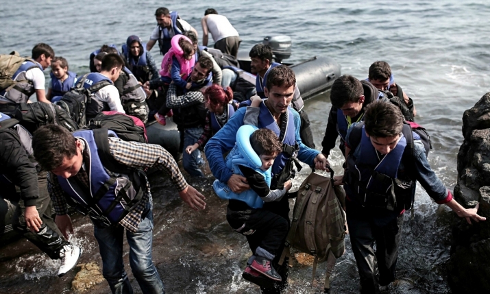 Syrian refugees coming ashore on the Greek island of Lesbos. From fair.org