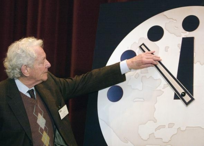 American experimental scientist Leon M. Lederman moves the hands of the Doomsday Clock to 11.53 p.m. in 2002. Photo by Tim Boyle. From slate.com
