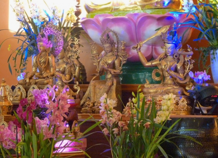 Tibetan statues displayed prominently on the altar