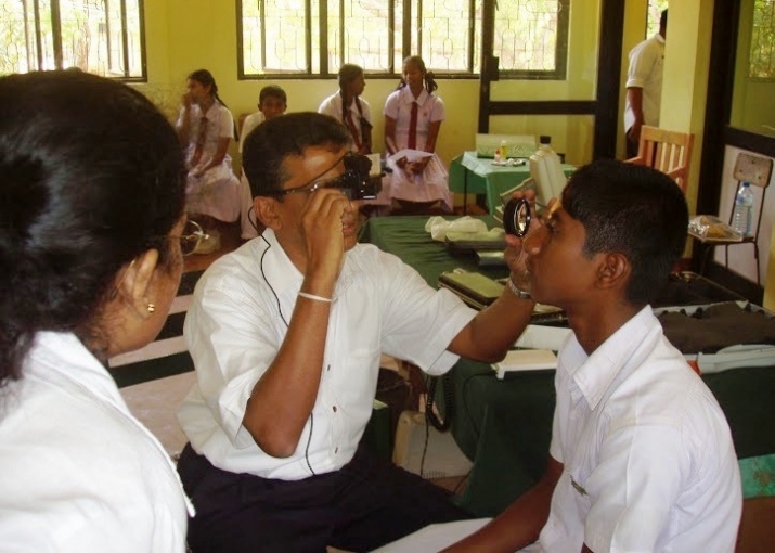 Dr. Nalin Goonesinghe conducting an eye examination