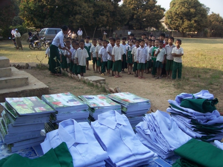 Distributing school supplies to eager students. From 100schools.org