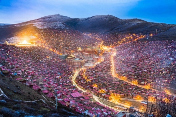 Thousands of cabins housing Larung Gar's monastic community line the hillsides surrounding the institute. Photo by Jesse Earl Rockwell. From metro.co.uk