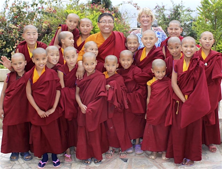 Julie Green, back row, center-right, and Tsoknyi Rinpoche, back row, center-left, with nuns from Tsoknyi Gechak Ling Nunnery and Educational Center. Image courtesy of Julie Green