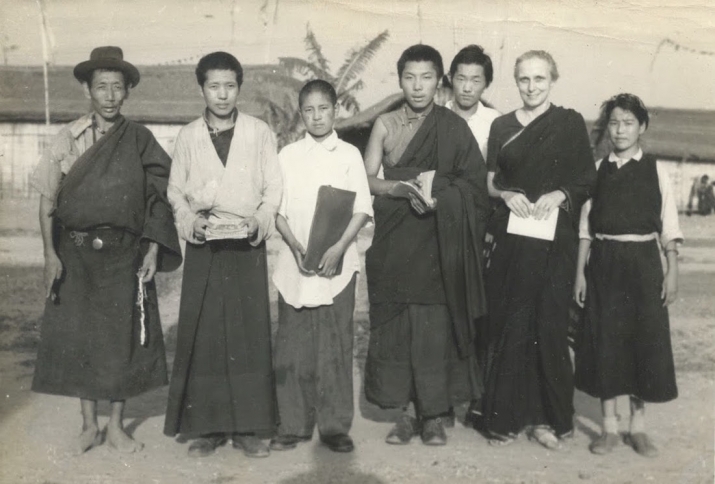 Freda Bedi at Baxa Camp in Assam in 1959 or 1960. The three young lamas holding books or documents are, left to right, Akong Rinpoche, Akong's brother Jamdrak (now called Lama Yeshe Rinpoche, the abbot of Kagyu Samye Ling Monastery in Scotland), and Trungpa Rinpoche. Image courtesy of the author