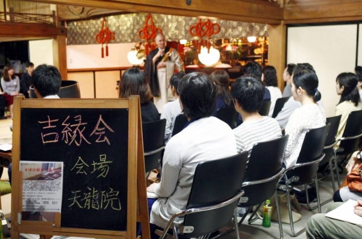 Men and women seeking spouses attend a matchmaking event at Tenryuin-ji, a temple in Tokyo. From japantimes.co.jp