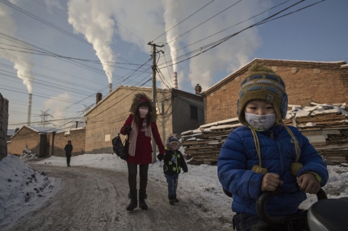 Local residents near a coal factory in China's Shanxi Province. From nytimes.com