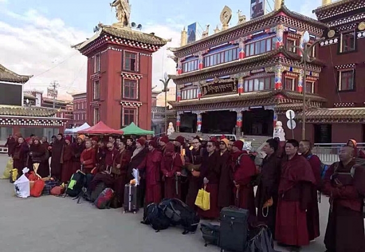 Expelled monks and nuns wait for transportation away from Larung Gar. From rfa.org