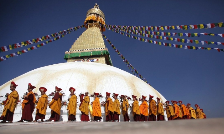 Buddhist monks perform the purification ceremony for Boudhanath Stupa. Photo by Niranjan Shresth. From the guardian.com