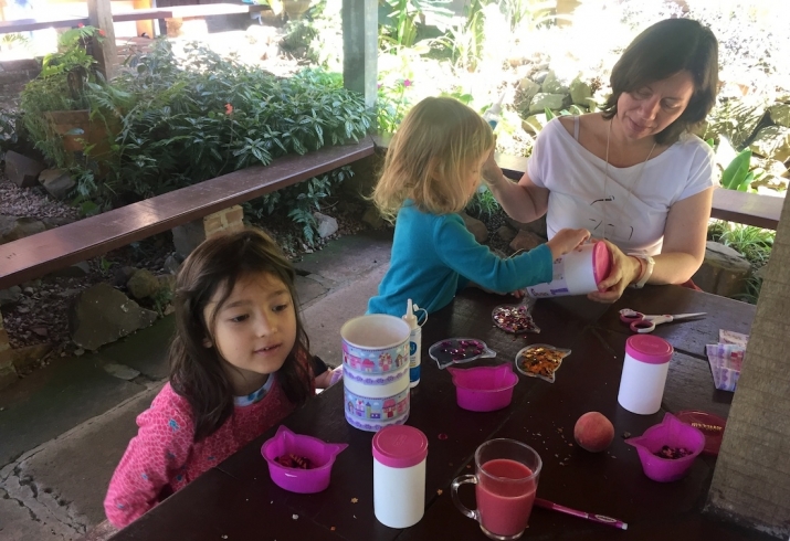 Amaya and Leela making gifts with a sangha friend. Image courtesy of the author