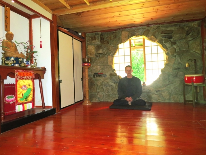 Eric Johns inside Precious Wood meditation Hut. Image courtesy of the author