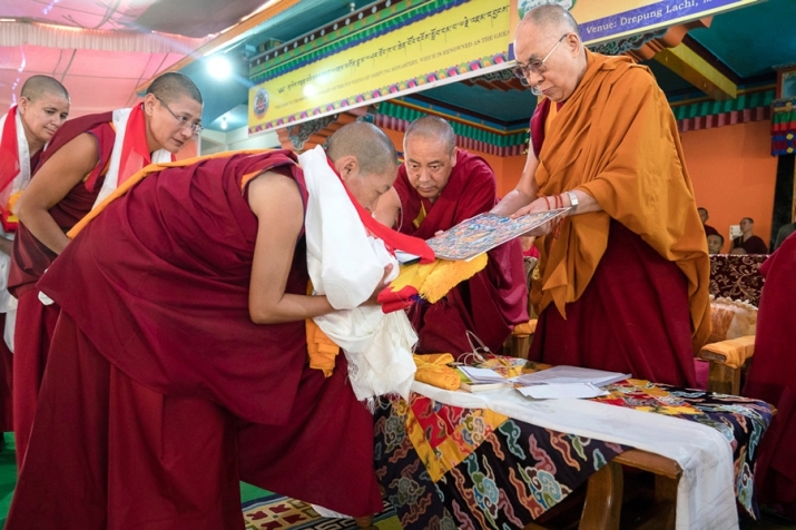 The Dalai Lama presents degree certificates to each of the 20 nuns. Photo by Tenzin Choejor. From dalailama.com