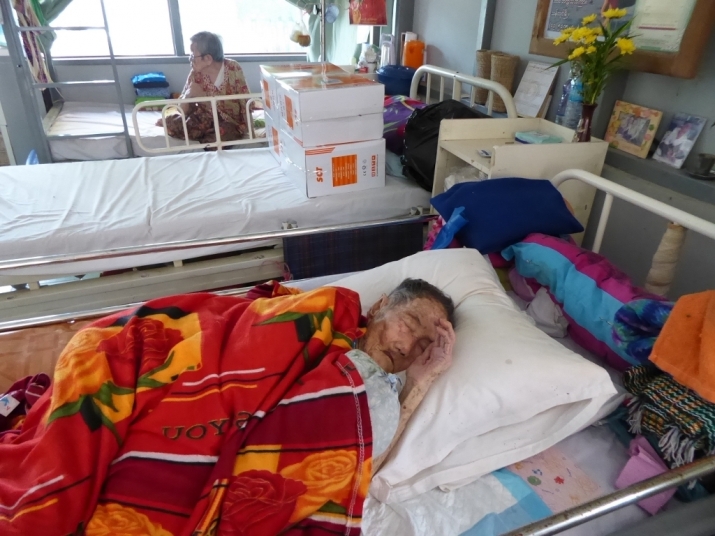 Aged 110, Daw Shwe lies hopeless and helpless in the intensive care unit