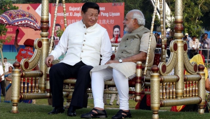 Chinese President Xi Jinping sits on a swing with Indian Prime Minister Narendra Modi at a riverside park in Gujarat in 2014. From scmp.com