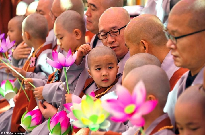 The boy monks and their teachers. From mailonline.com