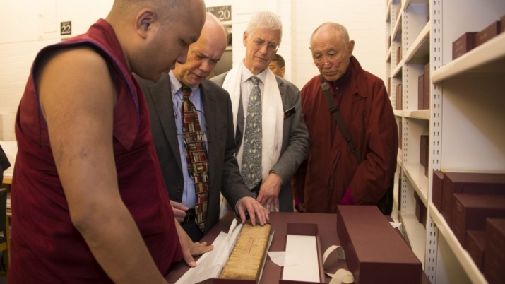 His Holiness views Tibetan manuscripts at the British Library. From kagyuoffice.org