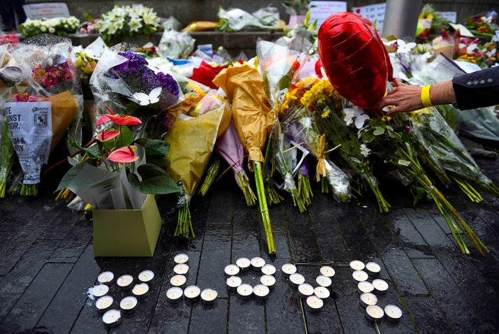 Floral tributes offered at Monday’s vigil near the scene of the attack at London Bridge. Photo by Clodagh Kilcoyne. From ibtimes.co.uk