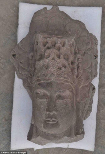 An unearthed carving of a bodhisattva head. From xinhuanet.com