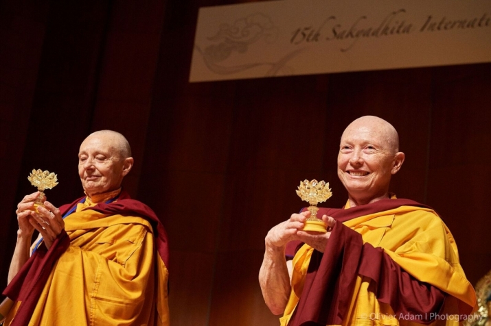Jetsunma Tenzin Palmo (left) and Karma Lekshe Tsomo (right) with the lotus lanterns. Image Sakyadhita International Association of Buddhist Women, Photographer Olivier Adam