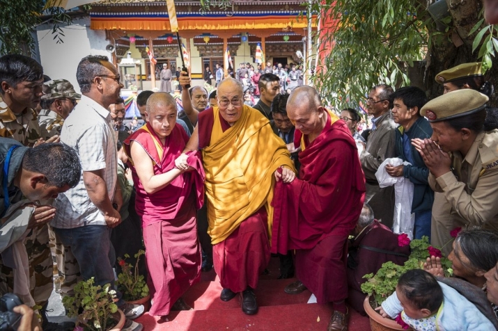 His Holiness is escorted to his car from the Jokhang temple in Leh on Wednesday. From dalailama.com