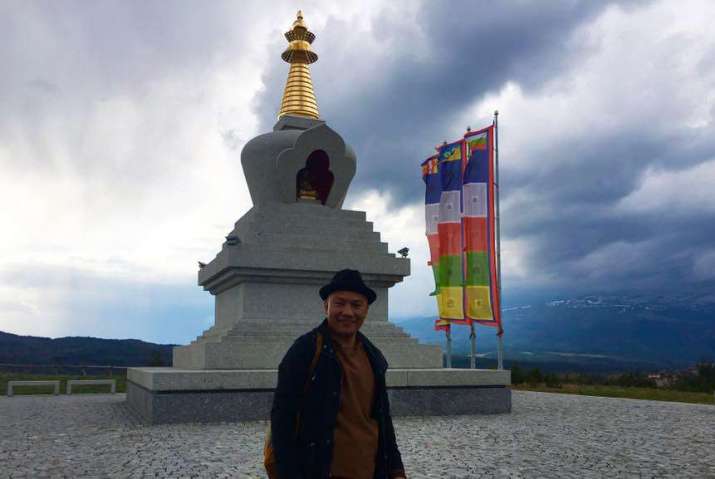 Geshe Lhundup at the Stupa of Enlightenment in the village of Plana, Bulgaria. Image courtesy of Geshe Lhundup